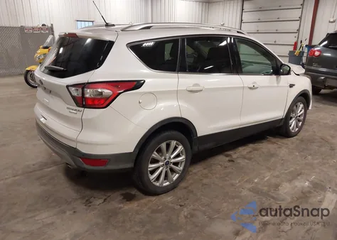 2017 Ford Escape Titanium z USA, uszkodzony, nr VIN 1FMCU0J96HUC25652